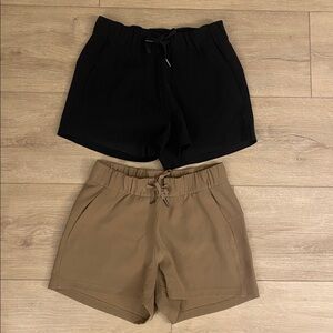 2 pairs Lululemon On The Fly Shorts Sz 4 Black & Brown